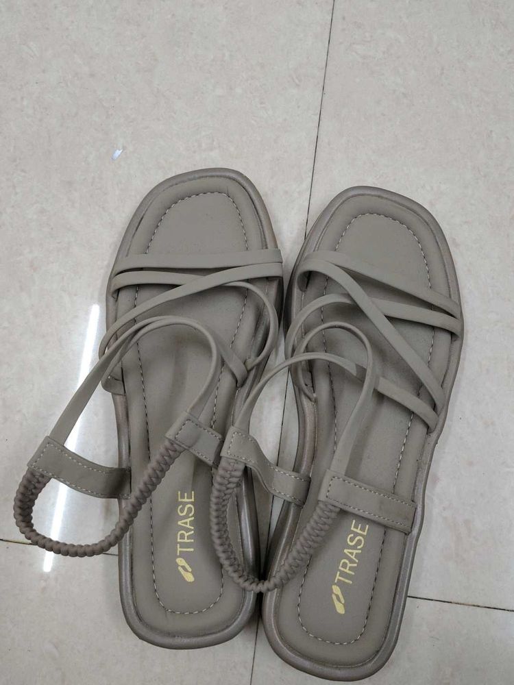 A khaki coloured women sandals