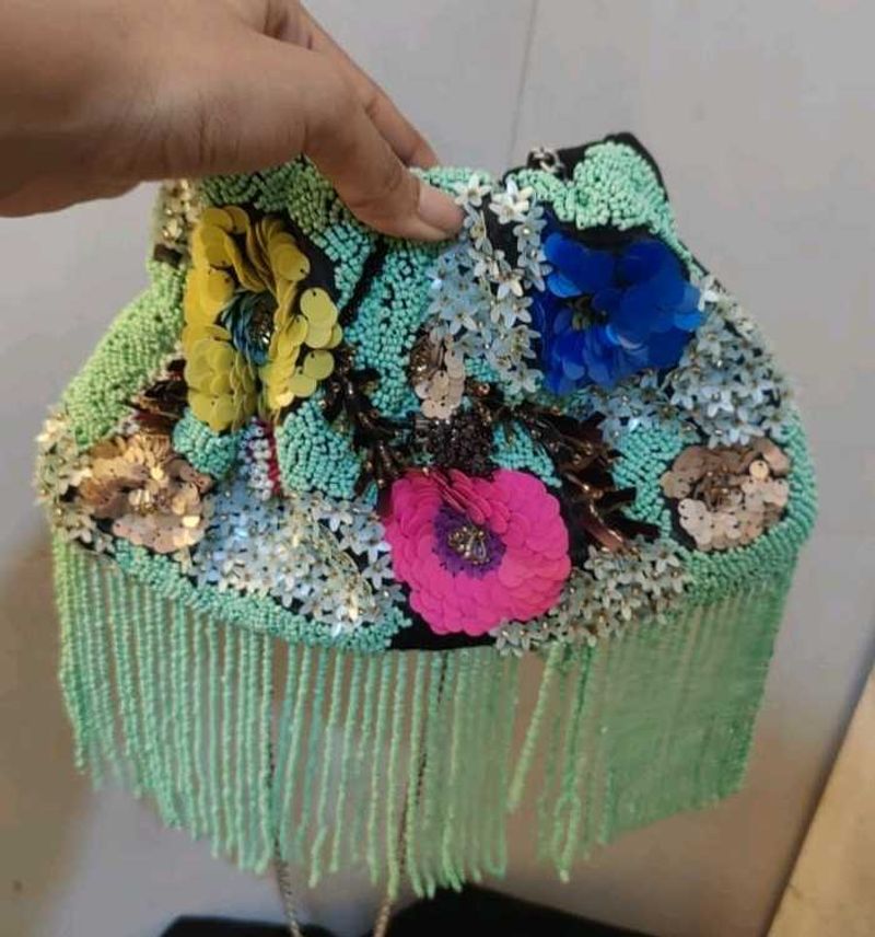 Beaded bag with tassel.