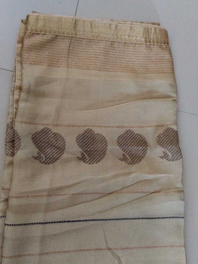 Elegant Beige Saree with Subtle Motifs