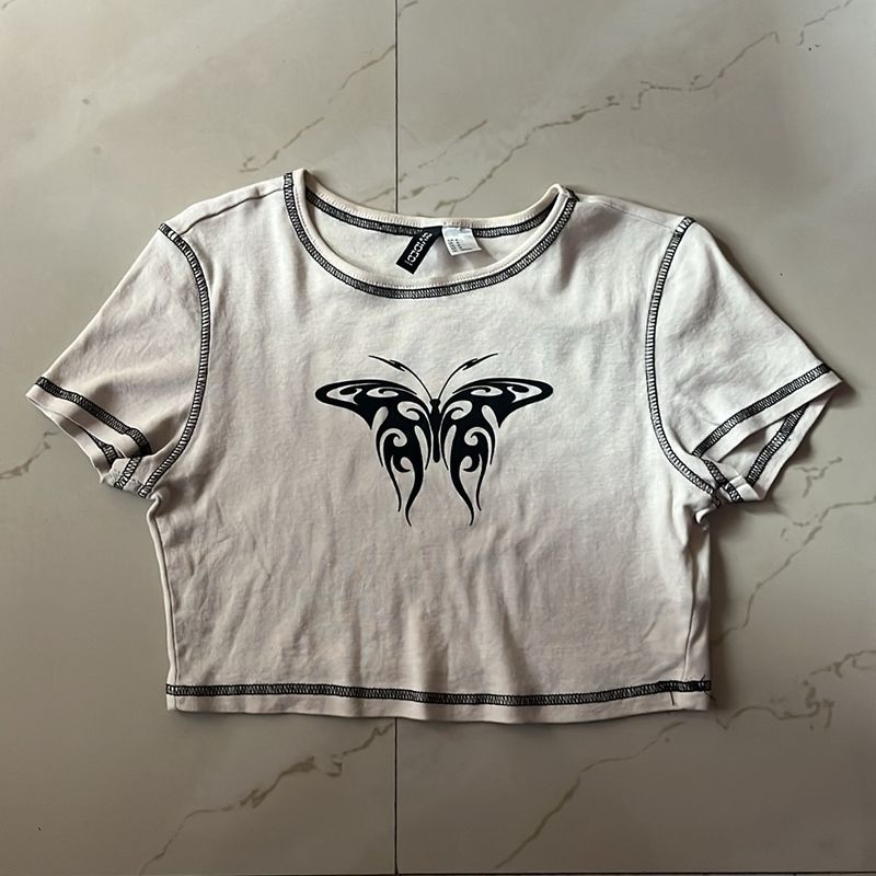 A symmetrical butterfly design crop top