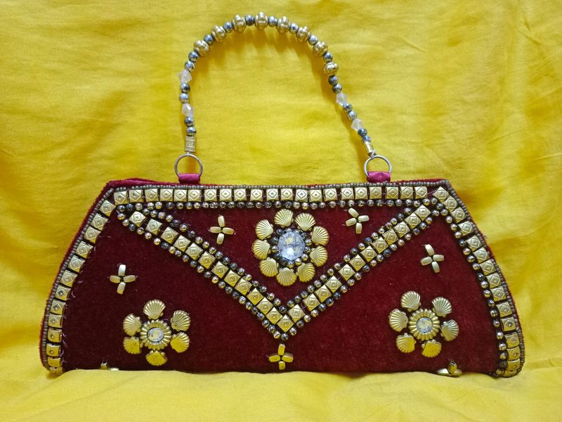 Dark maroon Fancy Clutch...