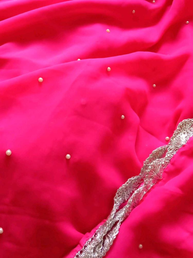 Vibrant Pink Saree with Pearl Embellishments