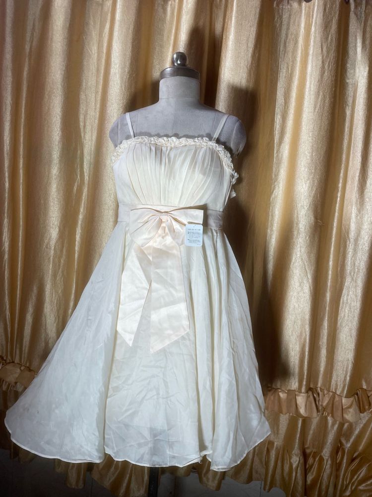 Elegant Cream Gown with Bow