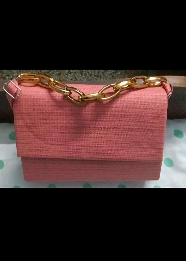 Chic Coral Clutch with Gold Chain
