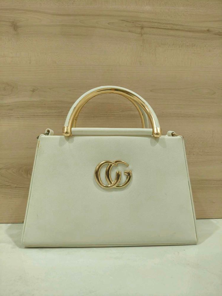 Elegant Cream Handbag with Gold Accents
