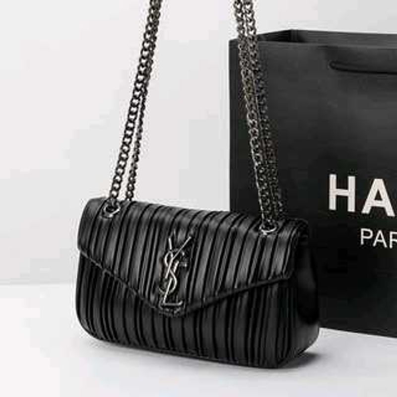 YSLsleek black shoulder bag features striking vert