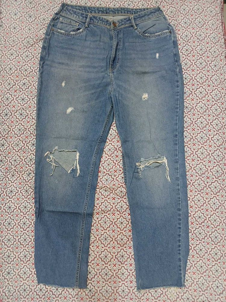 Distressed Blue Denim Jeans