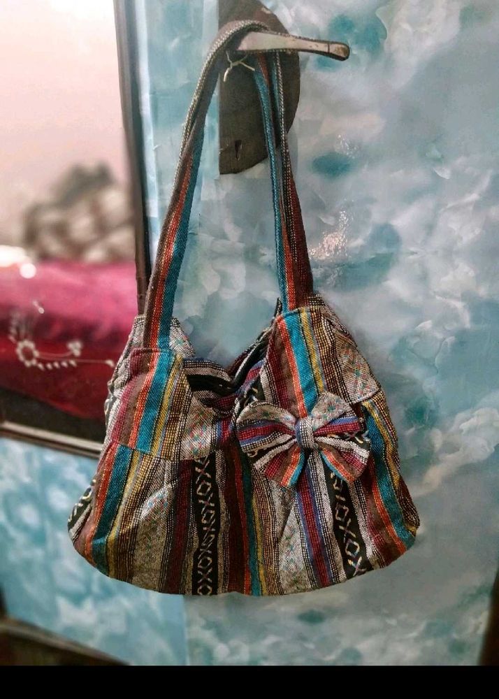 Boho Chic Striped Handbag with Bow Detail