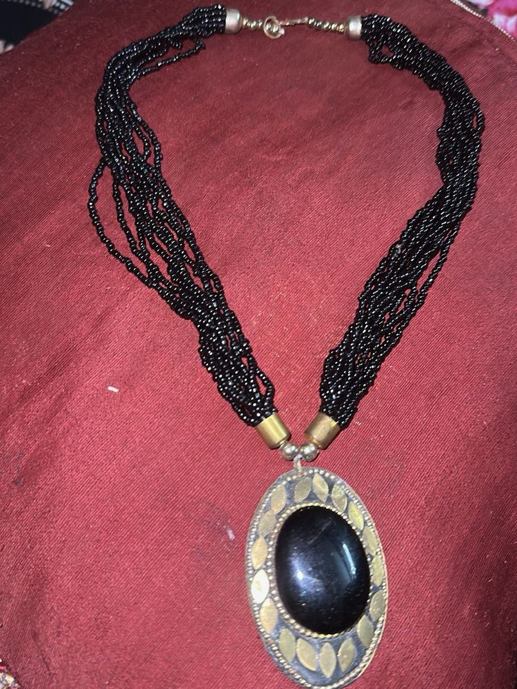 Elegant Beaded Necklace with Black Stone Pendant