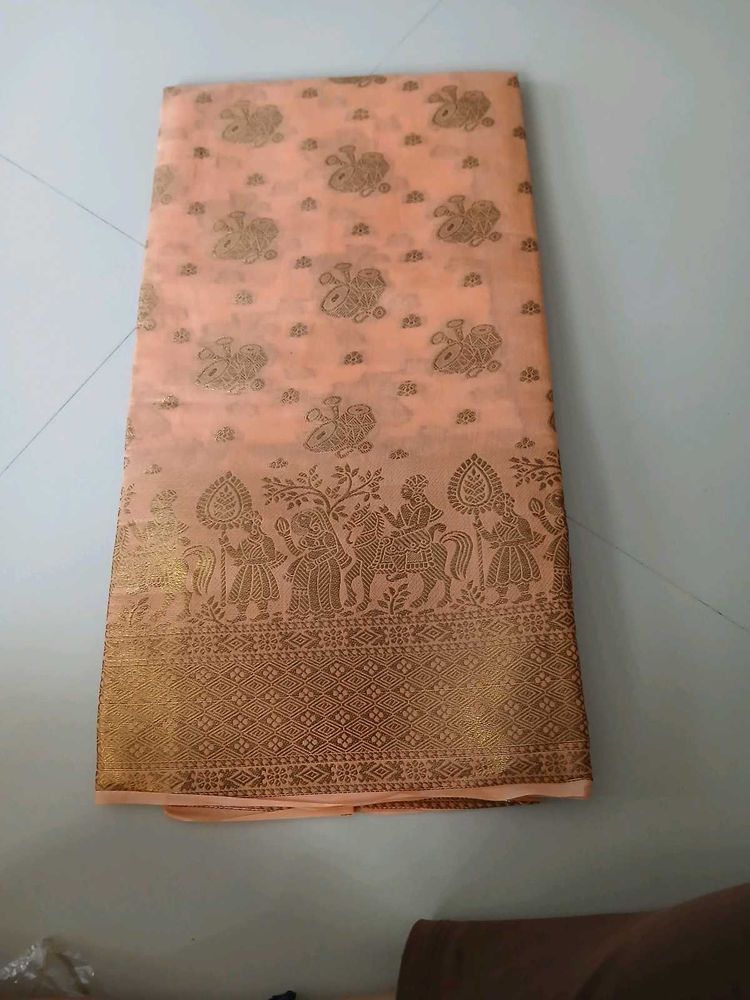 Elegant Peach Saree with Intricate Gold Print