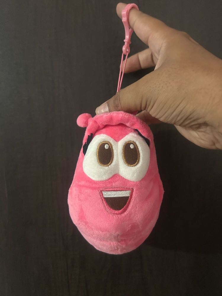pink Larva character plush keychain featuring