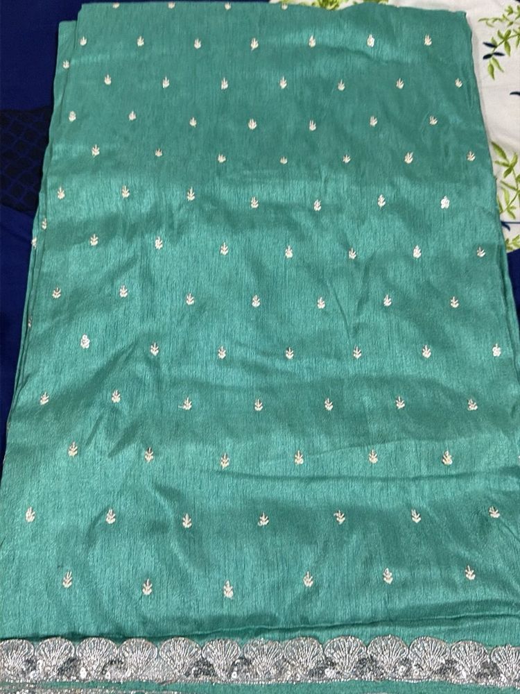 Elegant Teal Saree with Silver Border