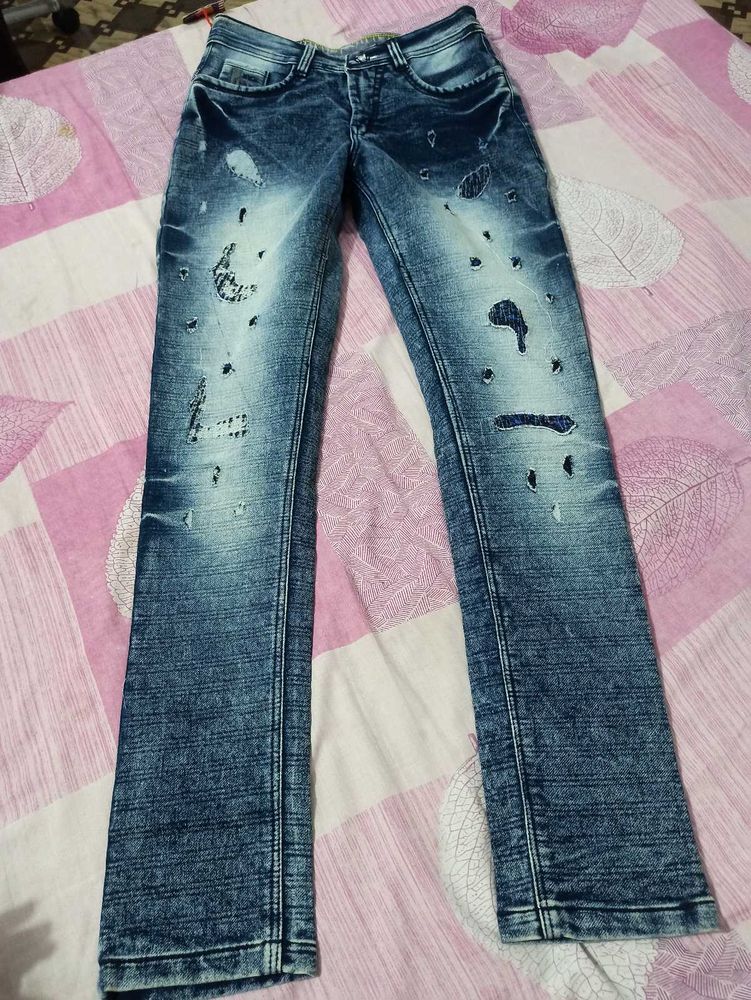 Distressed Blue Denim Jeans