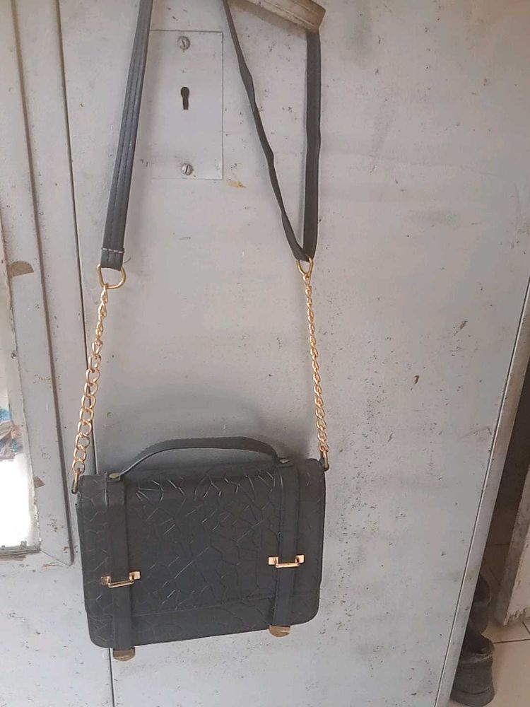 Chic Black Satchel Bag with Gold Accents