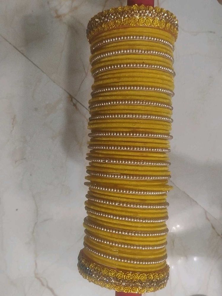Vibrant Yellow Bangle Set with Gold Embellishments
