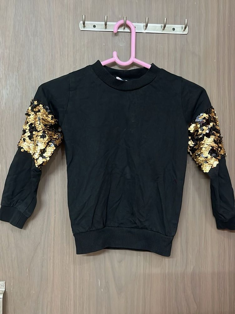 Black sequin sleeve top