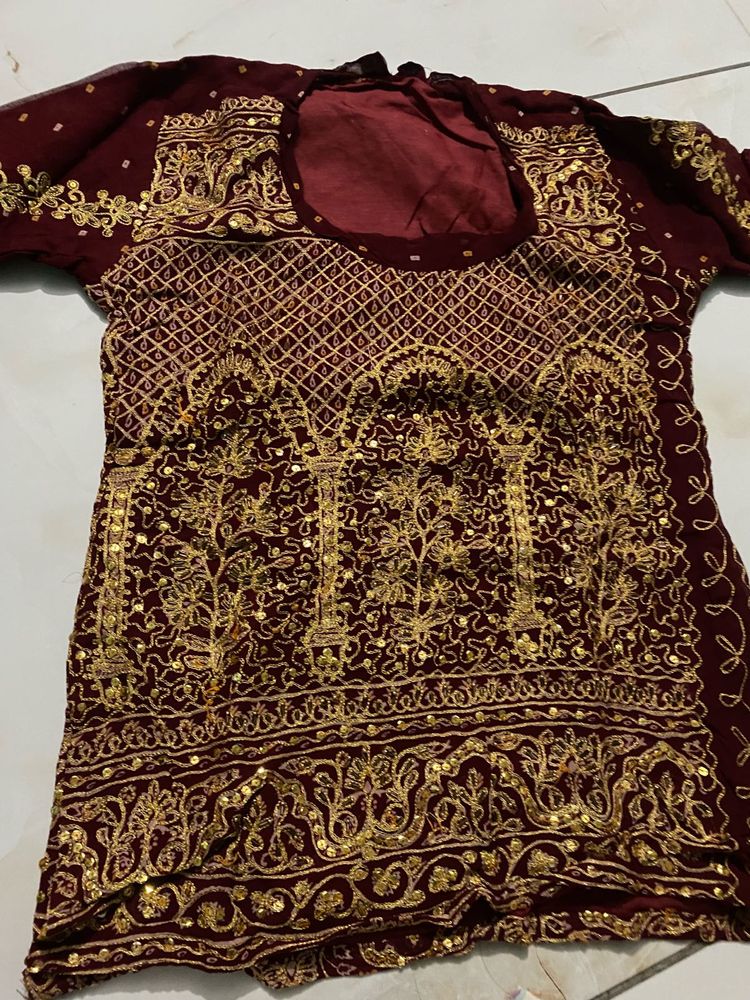 Exquisite Maroon &amp; Gold Embellished Lehenga Choli