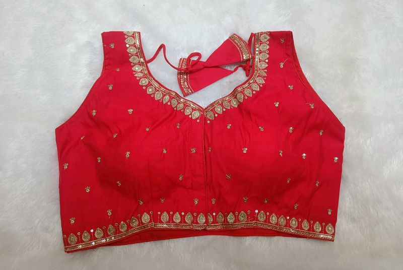 Sleeveless embroidered red blouse