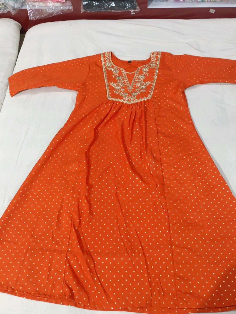 Vibrant Orange Kurti with White Polka Dots