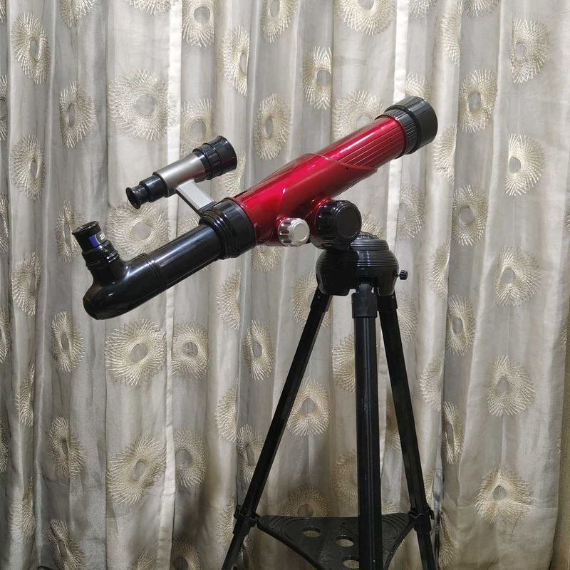 Red Telescope with Tripod