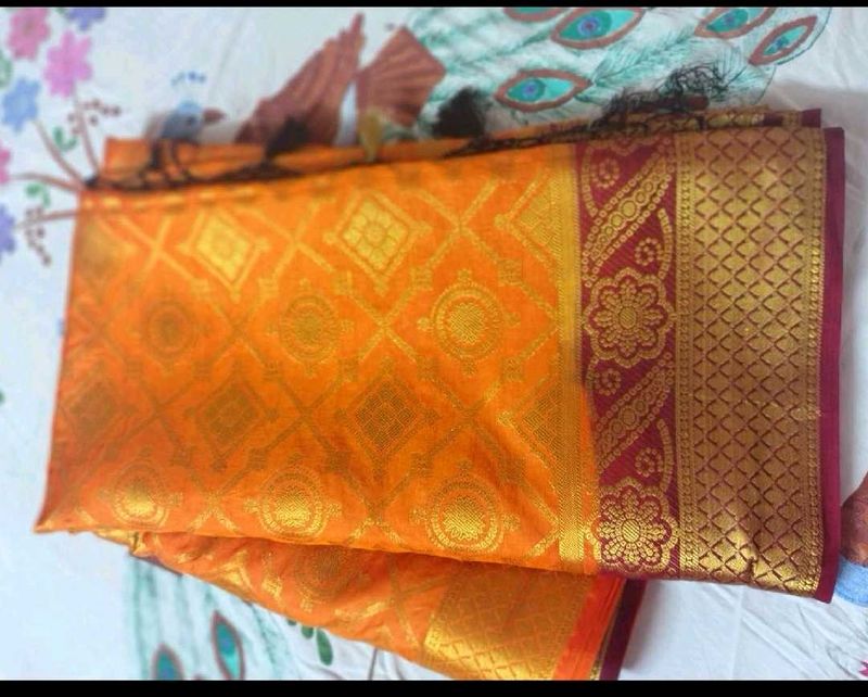 Orange Silk Saree with Gold Border