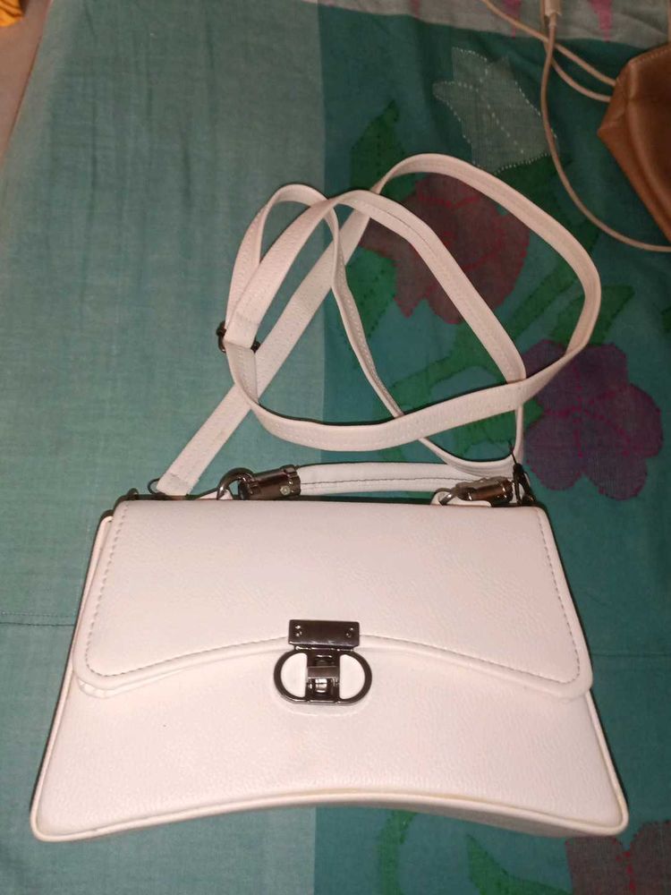 chic white sling and handbag