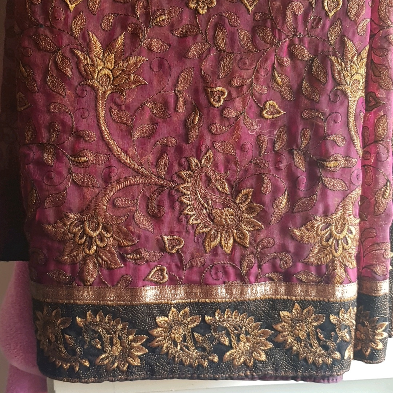 Silk type maroon saree with golden embroidery and