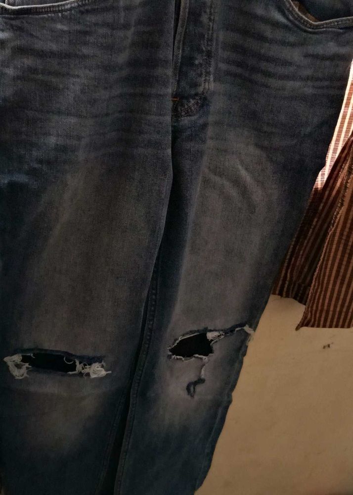 Ripped Knee Denim Jeans