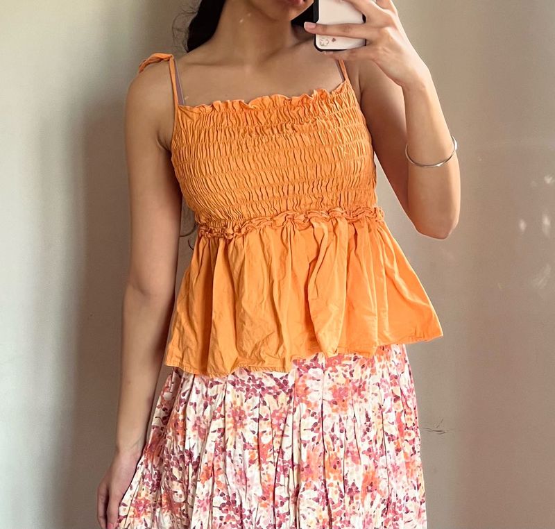 Orange Smocked Peplum Top