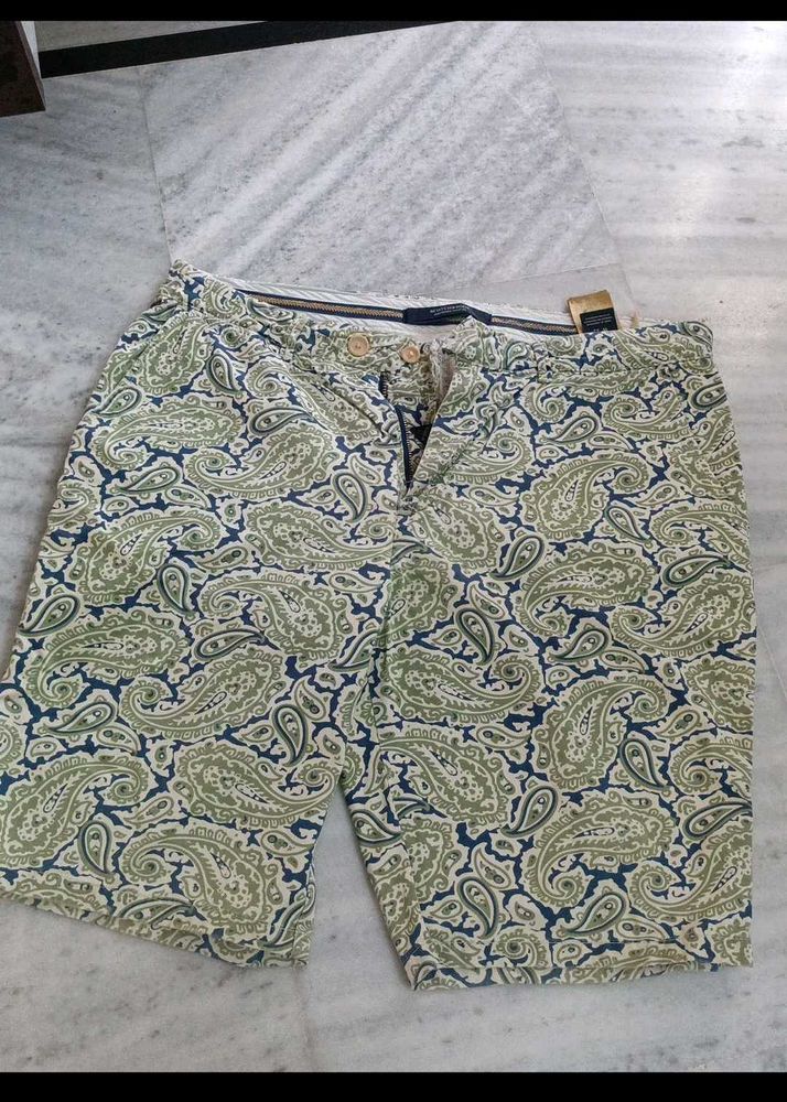 slightly torn shorts with brand