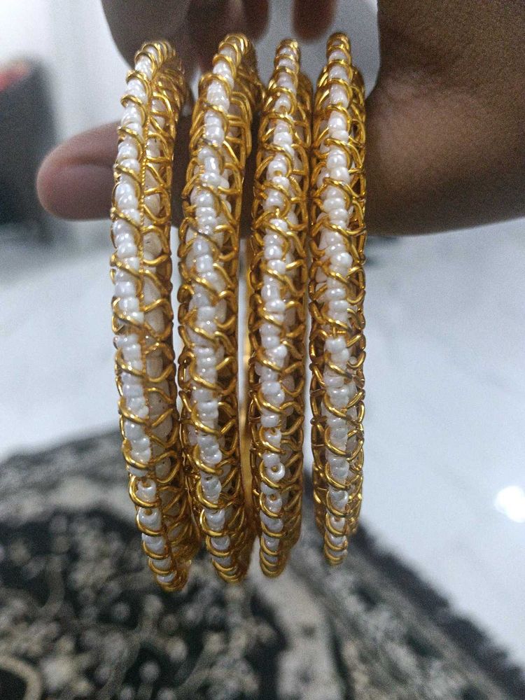 Elegant Gold and Pearl Bangles