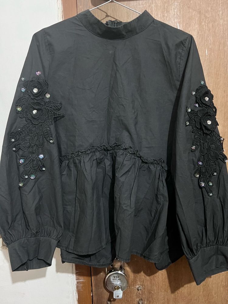 Chic Black Peplum Top with Embellishments