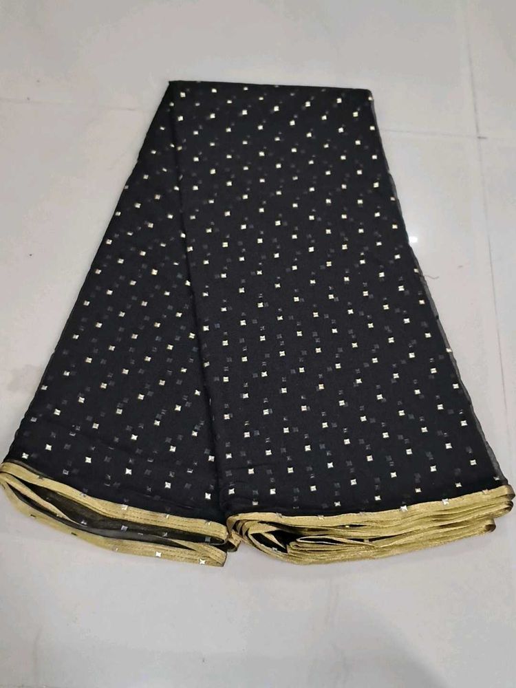 Elegant Black Saree with Gold Accents