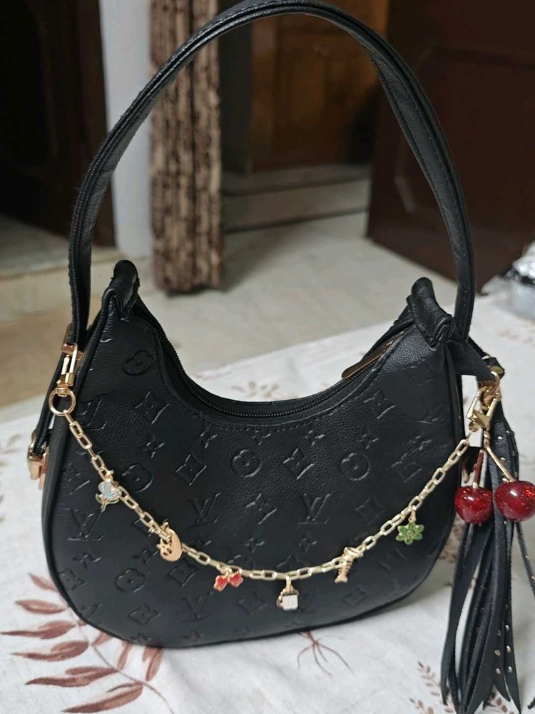 Chic Black Embossed Hobo Bag with Charms