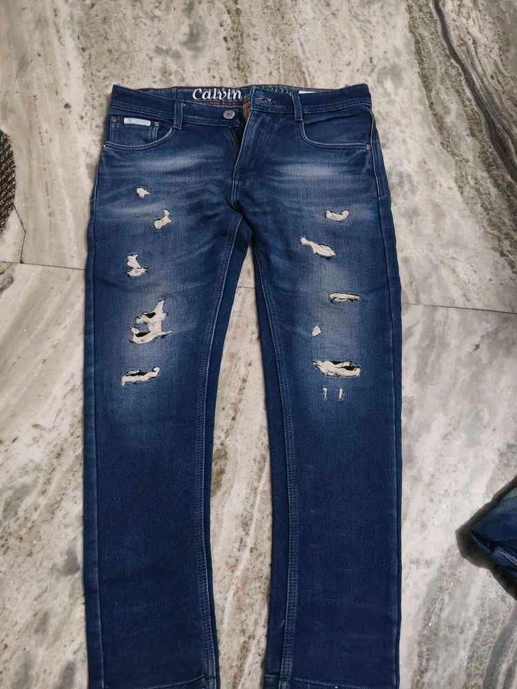 Calvin Klein trendy Distressed Blue Jeans for sale