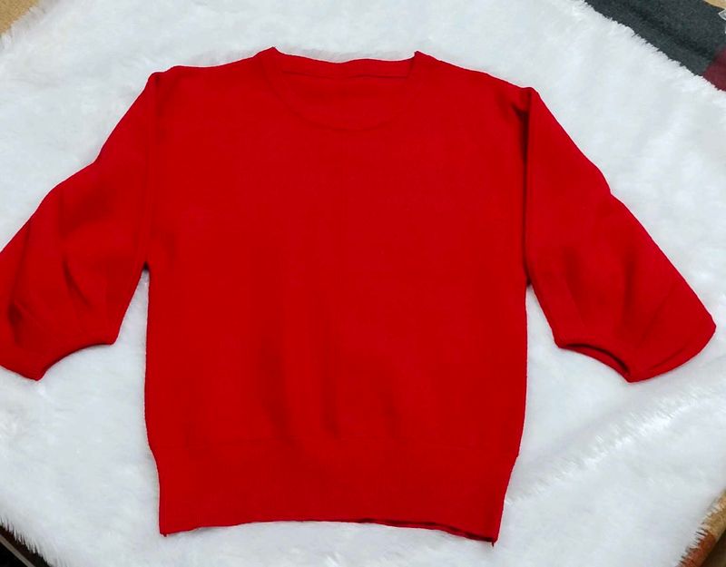red woolen top