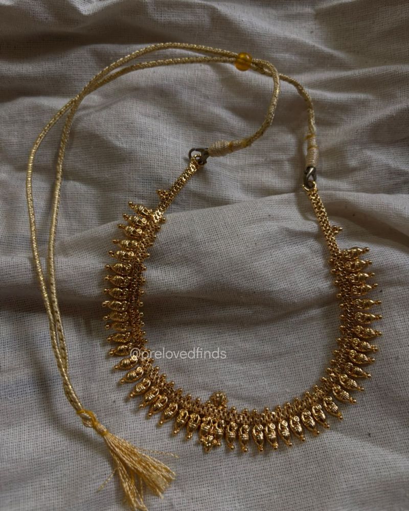 Elegant Gold Tone Necklace with Tassel