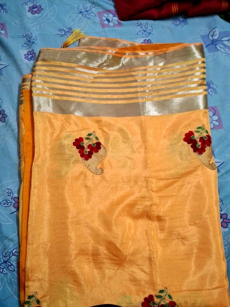 Elegant Orange Saree with Embroidery