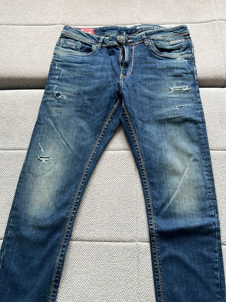 Distressed Blue Denim Jeans