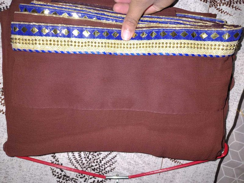 Elegant Brown Saree with Intricate Border