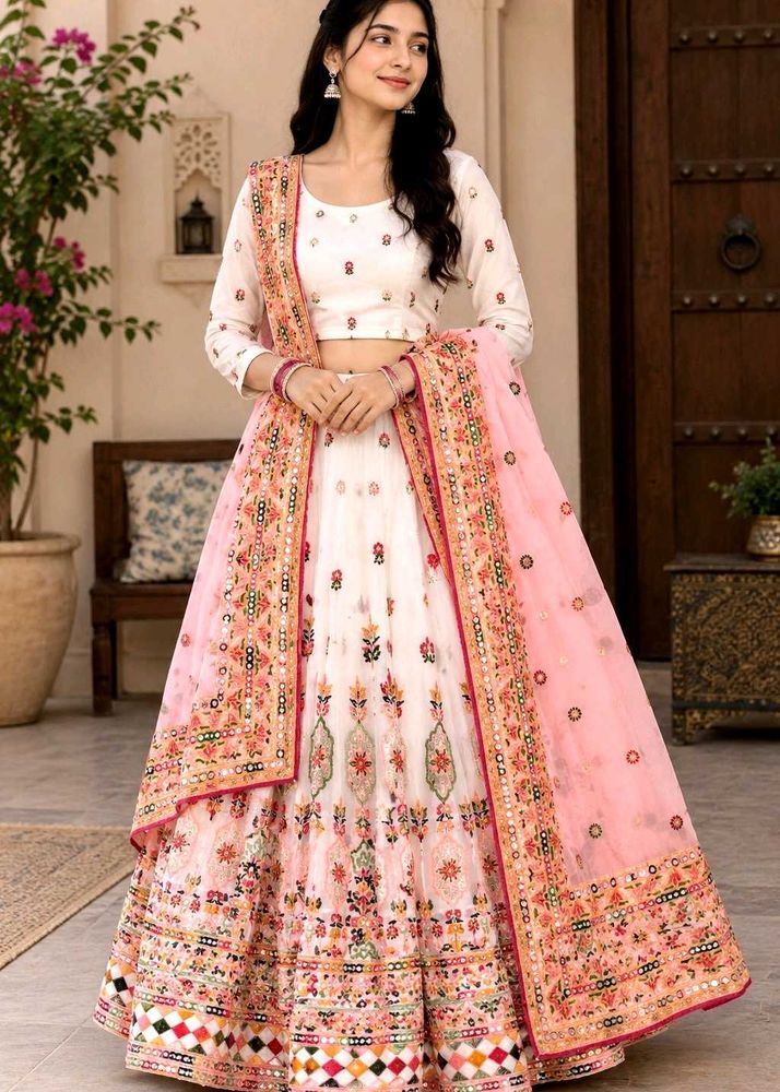 white multi pitch lehenga