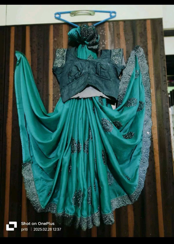 Elegant Teal Saree with Embellished Blouse