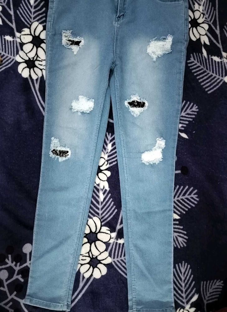 Ripped Light Wash Denim Jeans