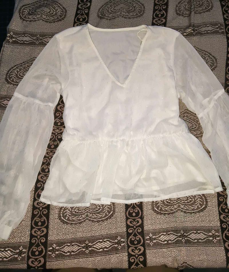 Sheer white peplum top with bell sleeves