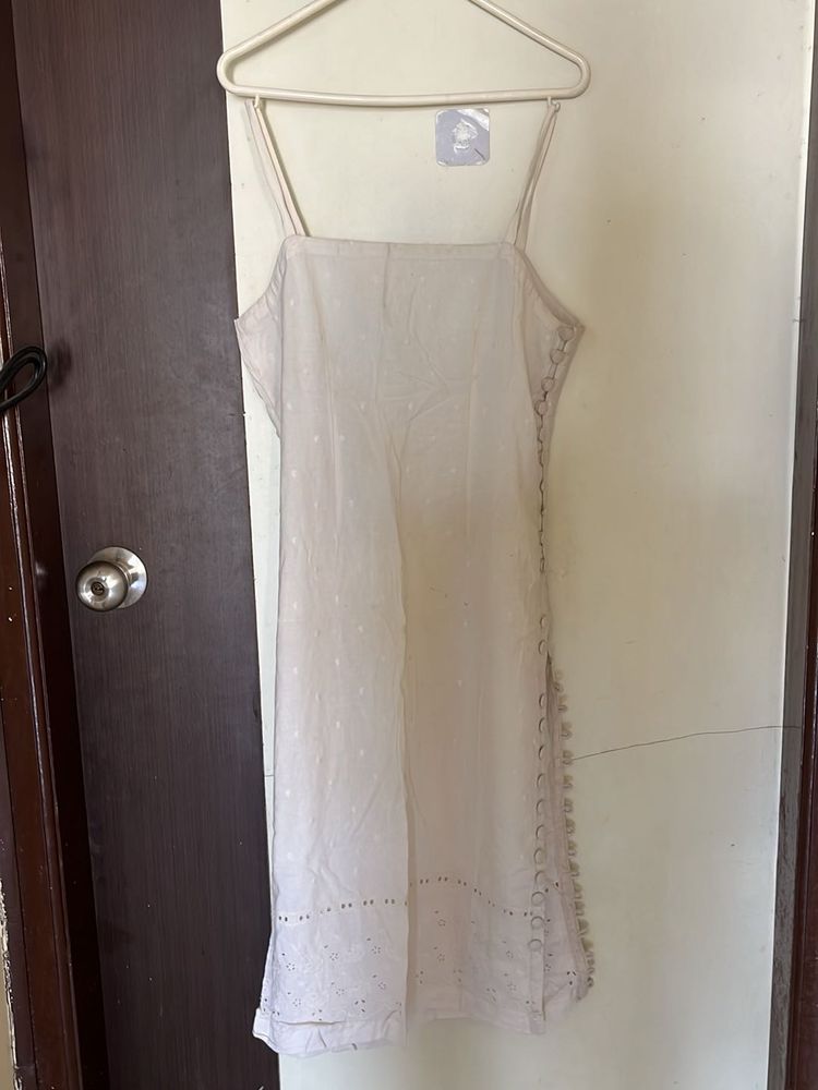 white sleeveless kurta with pink stripped pants
