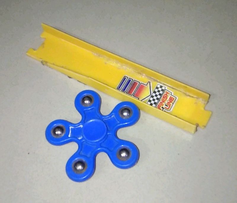 Blue Fidget Spinner And A Track Toy