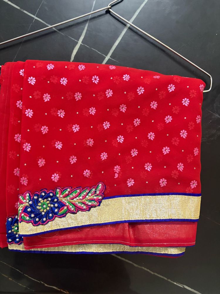 Vibrant Red Saree with Floral Embroidery