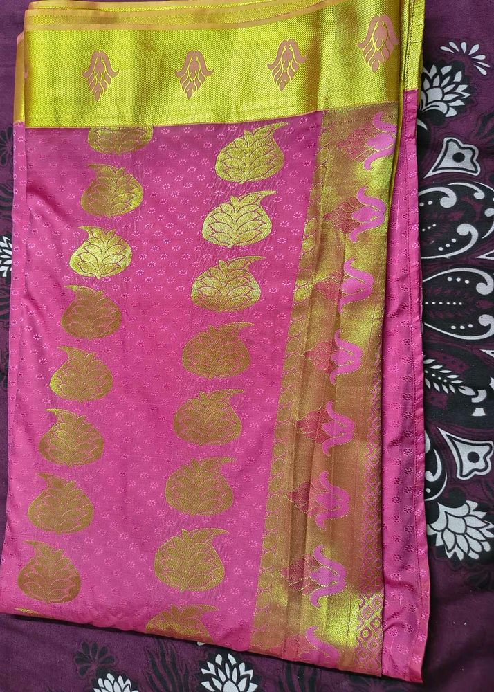 Vibrant Pink Saree with Golden Motifs