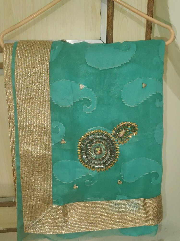 Elegant Teal Saree with Gold Border