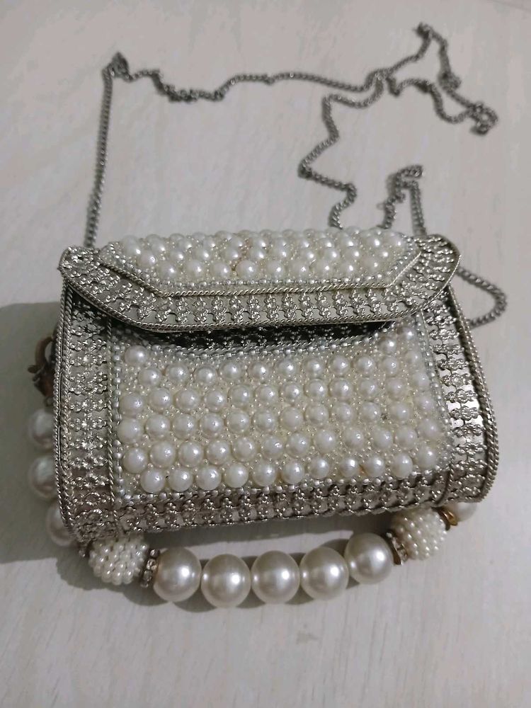 Elegant Pearl Embellished Clutch from Snatcher